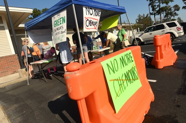 Hundreds of people turned out in protest as Chemours held a public meeting at the Leland Cultural Arts Center Wednesday Sept. 21, 2022 in Leland, N.C. Chemours is expanding its operation at its Fayetteville Works site and is talking to the public about their plans for the future.  KEN BLEVINS/STARNEWS