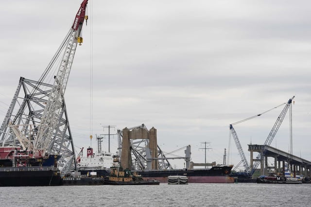 A bulk carrier moves through a newly opened deep-water channel in Baltimore after being stuck in the harbor since the Francis Scott Key Bridge collapsed four weeks ago, Thursday, April 25, 2024.