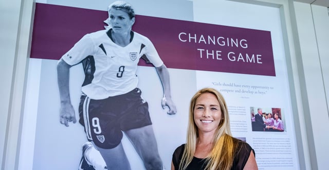 U.S. Olympic gold medalist Courtney Mathewson stands by an exhibit, "Evening the Odds: Women Leading the Way," at the Richard Nixon Presidential Library and Museum in Yorba Linda, Calif., on June 23, 2022. The exhibit opened on the 50th anniversary of then-President Richard Nixon signing the Education Amendments Act of 1972, which included Title IX, prohibiting sex discrimination at any institution receiving federal funding. But now, President Joe Biden's administration is attempting to radically revise Title IX in ways that would damage girls' and women's athletics. (Photo: Mark Rightmire/Media News Group/ Orange County Register/Getty Images)