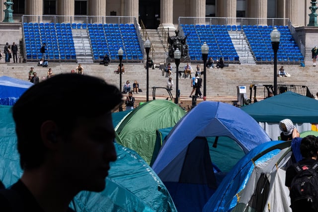 Tents set up by demonstrators are seen on the Columbia campus against the backdrop of the university's preparation for graduation ceremonies on April 24, 2024 in New York City. School administrators and pro-Palestinian, student protesters made progress on negations after the school set a midnight deadline for students to disband their encampment as tensions remained high on the campus.