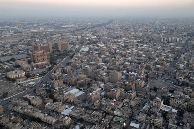 This aerial photograph taken on January 1, 2024 shows a view of buildings and streets in the Iraqi capital Baghdad.