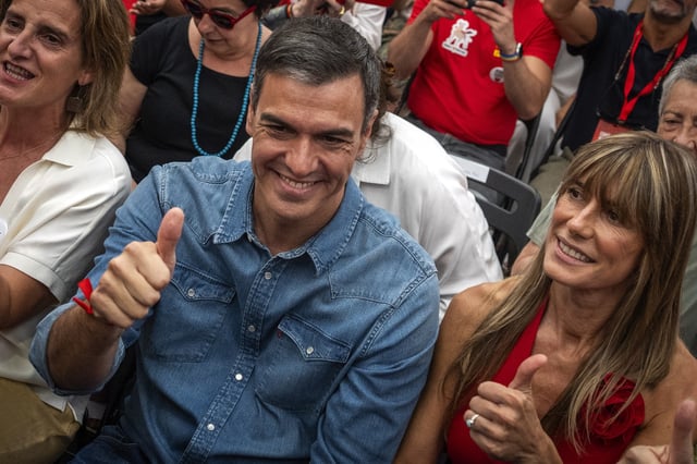 Spain's Prime Minister Pedro Sanchez next to his wife Begona Gomez, gives a thumb up during a campaign closing meeting in Madrid, Spain, Friday, July 21, 2023. Spain is in nail-biting suspense Monday as it waits for Prime Minister Pedro Sanchez to announce whether he will continue in office or not. Sanchez, 52, shocked the country on Thursday, announcing he was taking five days off to think about his future after a court opened preliminary proceedings against his wife on corruption allegations. (AP Photo/Emilio Morenatti, File)