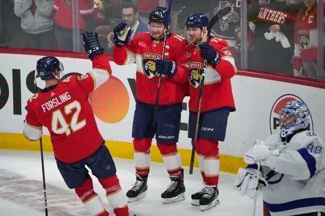 Florida Panthers center Aleksander Barkov (16) celebrates a short-handed goal with center Sam Reinhart (13) and defenseman Gustav Forsling (42) against the Tampa Bay Lightning.