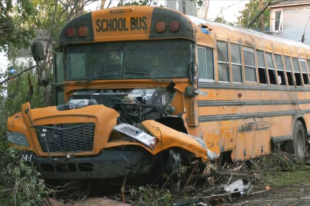 A damaged school bus on the side of a road in Westmoreland, Kan., on April 30, 2024.