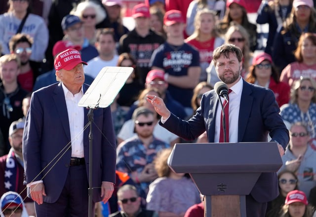 Former President Donald Trump appears with Sen. J.D. Vance at Dayton International Airport on March 16.