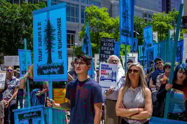 A crowd of hundreds gathers in Director Park for the #YouthvGov for the Right to a Livable Future rally on June 4, 2019, in Portland, Oregon.