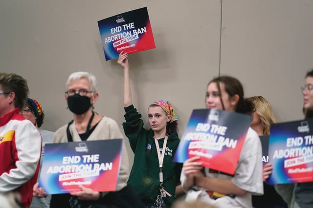 A supporter holds up a sign during Missourians for Constitutionals Freedom kick-off petition drive, in Kansas City, Missouri, in February 2024.