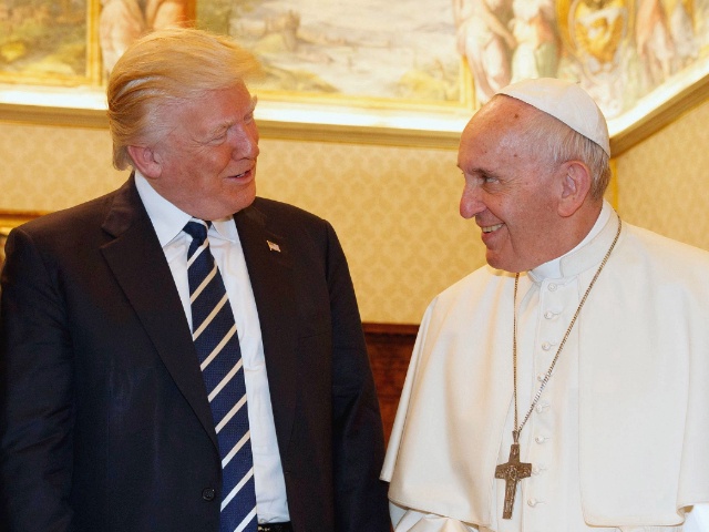 Pope Francis (R) exchanges gifts with US President Donald Trump and US First Lady Melania Trump during a private audience at the Vatican on May 24, 2017. US President Donald Trump met Pope Francis at the Vatican today in a keenly-anticipated first face-to-face encounter between two world leaders who have clashed repeatedly on several issues. / AFP PHOTO / POOL / Evan Vucci (Photo credit should read EVAN VUCCI/AFP via Getty Images)