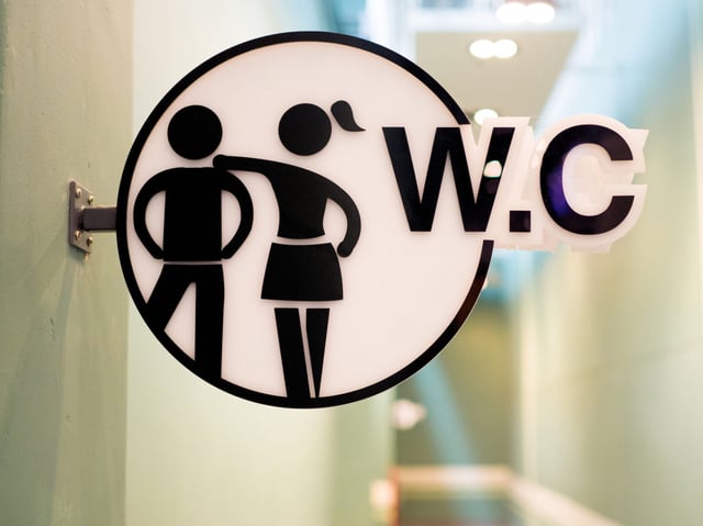 Close up WC sign in public toilet