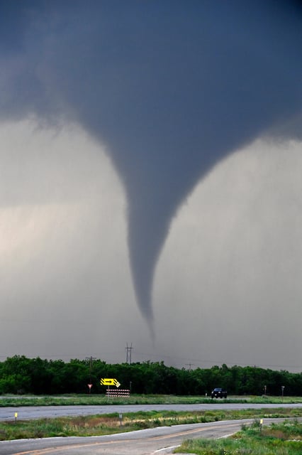 A tornado spins west of Hawley, Texas as cars pass on U.S. 277 Thursday May 2, 2024. Damage was reported in Hawley, with hail reported up to baseball size. (Via OlyDrop)