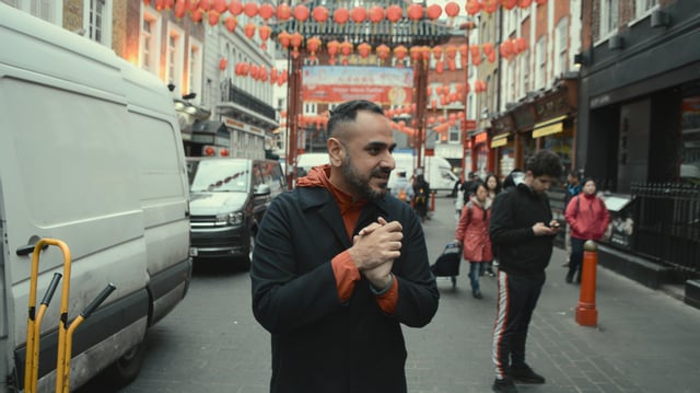 The so-called "Hollywood Con Queen" Hargobind Tahilramani in footage from his former food blog, as featured in the documentary by the same name on Apple TV+.