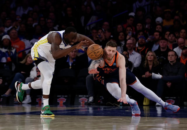 Draymond Green of the Golden State Warriors steals the ball from Isaiah Hartenstein of the New York Knicks at Madison Square Garden on Feb. 29, 2024, in New York. The Warriors defeated the Knicks 110-99.