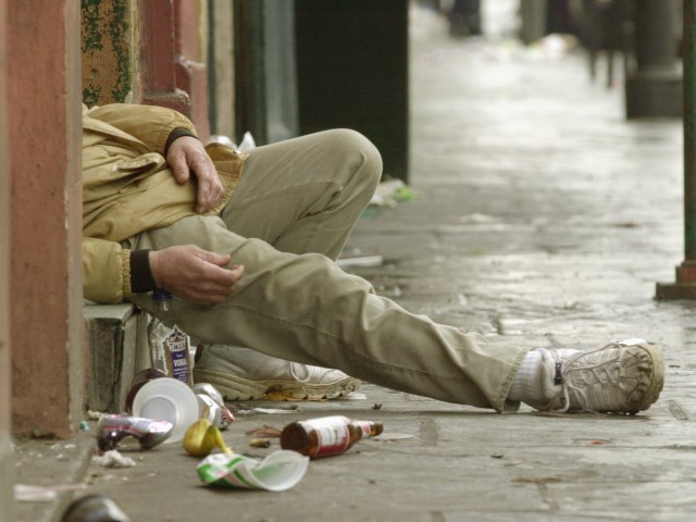 This Mardi Gras reveler didn't quite make it home and found a step in the French Quarter of New Orleans to rest from celebrating the carnival festivities Wednesday morning February 13, 2002. Mardi Gras, or Fat Tuesday, is the city's final fling before Lent, which begins with Ash Wednesday. (Bill Haber/AP)