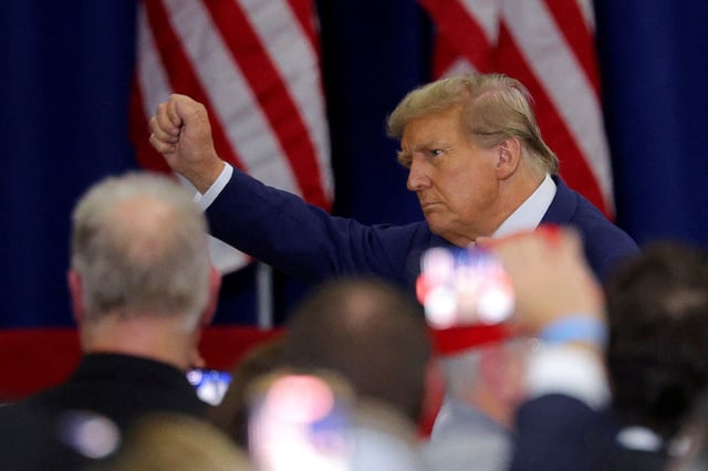 Former President Donald Trump gestures during a campaign rally in Green Bay, Wisconsin, on April 2, 2024.