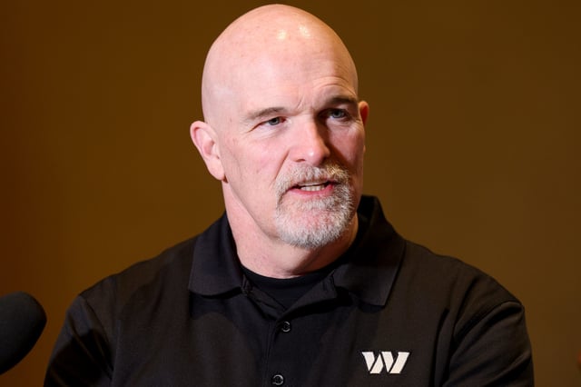 Washington Commanders head coach Dan Quinn speaks to the media during the NFL annual league meetings at the JW Marriott.