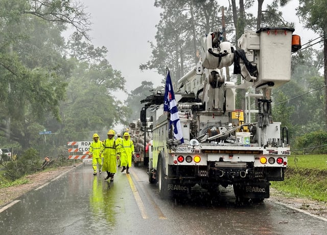 Repair crews from Lafayette (Louisiana) Utilities System arrive with new power poles at Aenon Church Road, three days after tornadoes and 100-mph straight-line winds caused widespread damage and power outages across Tallahassee and Leon County.