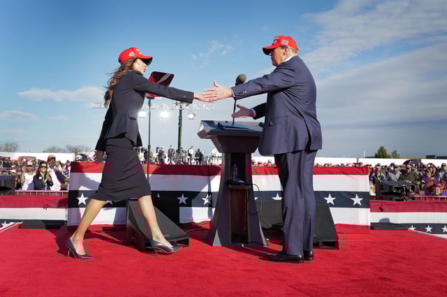 Republican presidential candidate former President Donald Trump greets South Dakota Gov. Kristi Noem during a rally at the Dayton International Airport on March 16 in Vandalia, Ohio.