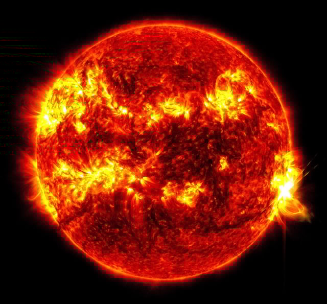 NASA’s Solar Dynamics Observatory captured this image of a solar flare – as seen in the bright flash on the right – on May 14, 2024. The image shows a subset of extreme ultraviolet light that highlights the extremely hot material in flares and which is colorized in red and yellow. Credit: NASA/SDO