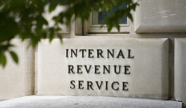 A sign outside the Internal Revenue Service building in Washington, on May 4, 2021. The Internal Revenue Service says it is conducting a comprehensive review of safety at its facilities. The action comes in response to an increasing number of threats borne of conspiracy theories that agents were going to aggressively target middle-income taxpayers. (AP Photo/Patrick Semansky)