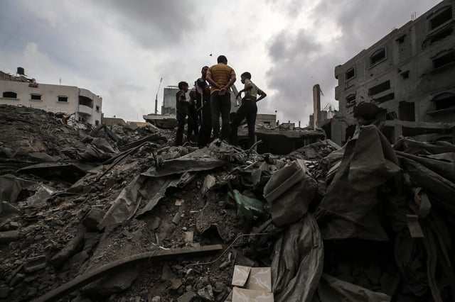 Palestinians are checking the damage in a house that was destroyed by an overnight Israeli bombardment in Nuseirat camp in the central Gaza Strip, on April 27, 2024.
