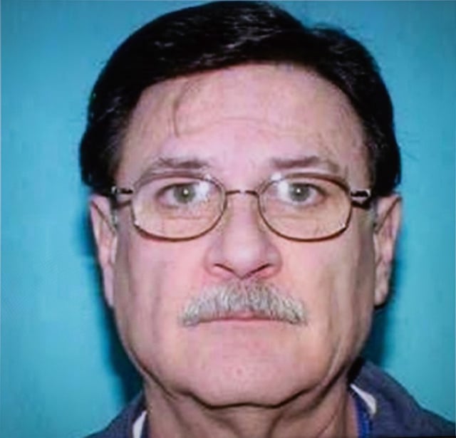 A copy photo of Gary Allen Srery, a deceased serial killer who the Alberta RCMP linked to four historical homicides, is shown during a press conference in Edmonton, Friday, May 17, 2024.