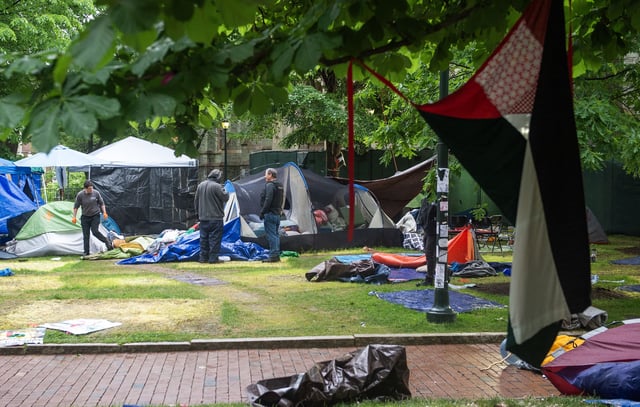 Maintenance staff and waste disposal crews clean up after police cleared a pro-Palestinian protest encampment on the campus of the University of Pennsylvania in Philadelphia, Pennsylvania on May 10, 2024.