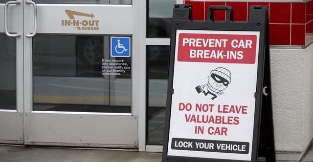 A sign warns patrons of car break-ins at the In-N-Out Burger off Hegenberger Road in Oakland, Calif., on Monday, Jan. 22, 2023. (Photo: Jane Tyska/Digital First Media/East Bay Times /Getty Images)