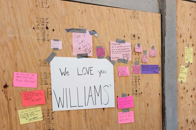 Neighbors posted words of support and kindness on the boarded up exterior of the home of local dog walker Terry Williams' on the 900 block of Grove Street in San Francisco on Wednesday, May 22, 2024. A day prior, a one-alarm fire broke out at Williams’ home just weeks after Terry received two racist packages at his front door.