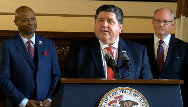 Gov. J.B. Pritzker (center), Illinois House Speaker Emanuel “Chris” Welch (left) and Illinois Senate President Don Harmon (right) discuss the budget agreement Wednesday afternoon. 