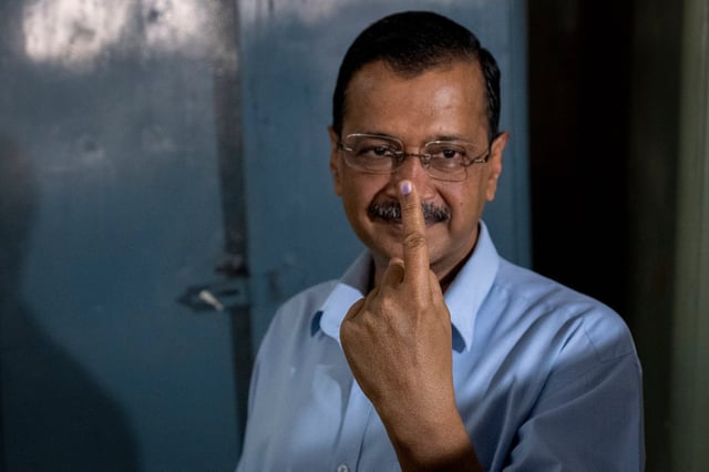 Aam Aadmi Party leader and Chief Minister of Delhi, Arvind Kejriwal shows his index finger marked with indelible ink at a polling booth after casting his vote in India’s national election in New Delhi, India on Saturday. Photo: AP