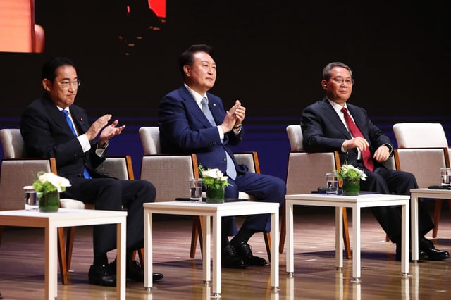 Japan's Prime Minister Fumio Kishida, South Korea's President Yoon Suk Yeol, and China's Premier Li Qiang attend a business summit in Seoul, South Korea, on May 27, 2024.