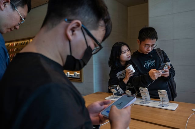 People look at the newly launched iPhone 15 at a flagship store in Beijing, China on September 22, 2023.