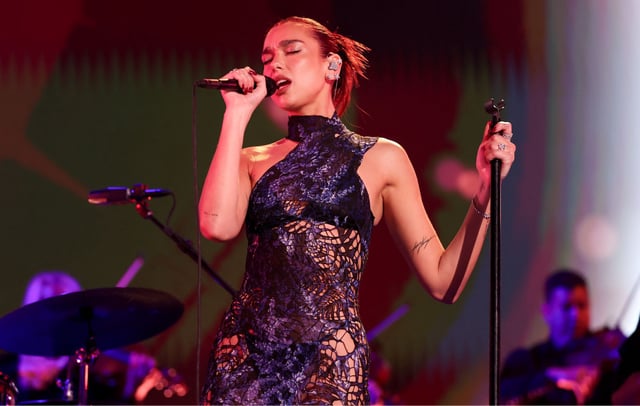 Dua Lipa performs onstage in 2024. CREDIT: Christopher Polk/Penske Media via Getty Images