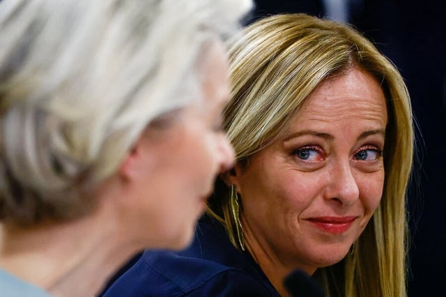 European Commission President Ursula von der Leyen and Italian Prime Minister Giorgia Meloni attend a press conference after visiting an Italian reception center for migrants. 