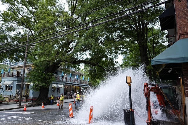 Water gushes out of a broken water transmission line in Atlanta on Saturday.