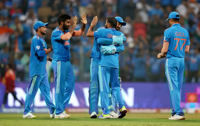 Mohammed Shami of India celebrates with teammates after dismissing Lockie Ferguson of New Zealand to win the ICC Men's Cricket World Cup India 2023 Semi Final match between India and New Zealand at Wankhede Stadium on November 15, 2023 in Mumbai, India.