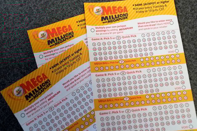 Mega Millions playslips are seen on a counter at a convenience store Tuesday, Jan. 3, 2023, in Northbrook, Ill. (AP Photo/Nam Y. Huh)