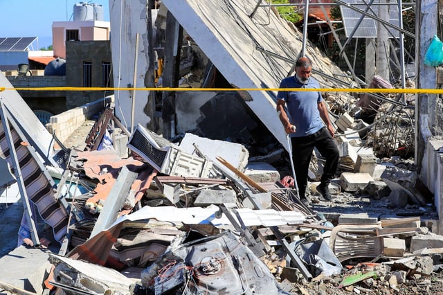 A Lebanese man inspects a destroyed house that was hit on Friday night by an Israeli airstrike on 31 May. Photo: Associated Press / Alamy