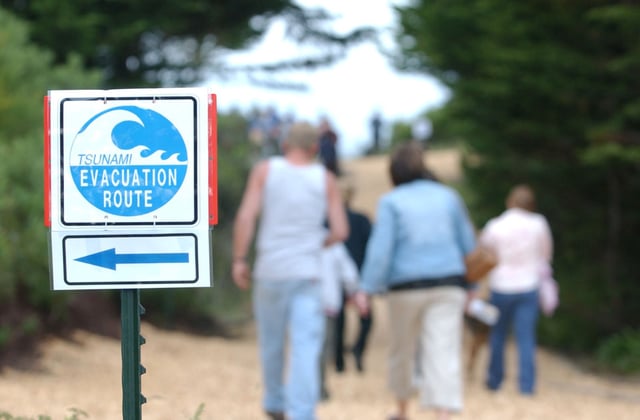Residents walk toward the designated safe area in a tsunami drill, in Samoa, Calif., on June 28, 2007. 