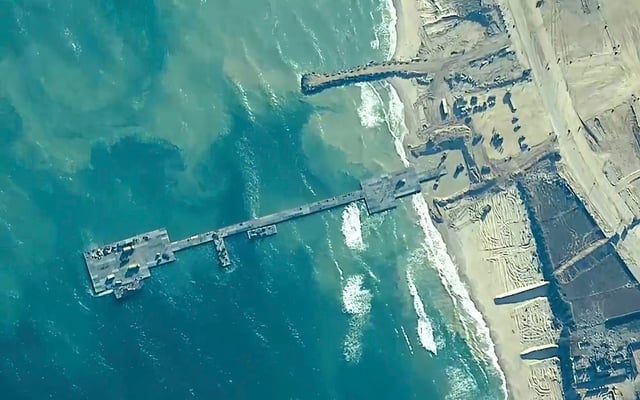 US Army soldiers, US Navy sailors and Israel Defense Forces placing the Trident Pier on the coast of Gaza Strip on May 16. Photo: AP