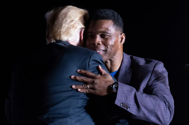 Donald Trump with Herschel Walker during his Save America rally in Perry, Ga., in 2021. 