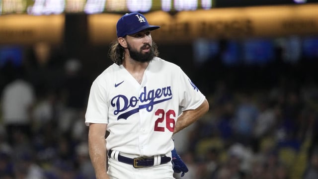 Dodgers pitcher Tony Gonsolin leans to his side and stares from the mound during  a loss