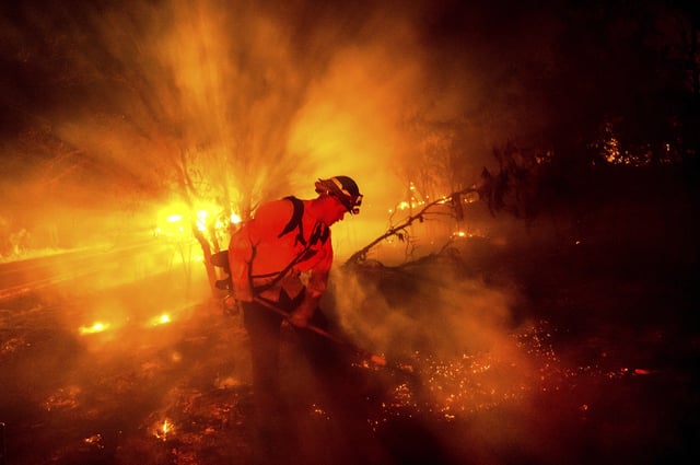 Firefighter Chris Fritz works to keep the Aero Fire from spreading through the Copperopolis community of Calaveras County, Calif., on Monday, June 17, 2024. (AP Photo/Noah Berger)