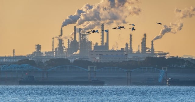 Smoking oil refinery by the Yangtze River, China