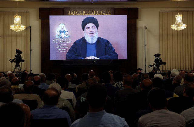 Lebanon's Hezbollah leader Sayyed Hassan Nasrallah speaks during a televised address at a memorial service for Taleb Abdallah, a senior field commander in the group who was killed on June 11 alongside three other Hezbollah fighters in an Israeli strike on the south Lebanon village of Jouaiyya, in Beirut's southern suburbs, Lebanon June 19, 2024. REUTERS/Mohamed Azakir