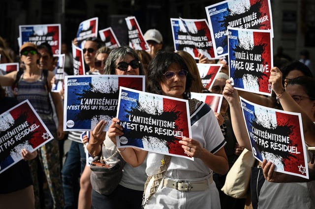 Protesters gather to condemn the alleged antisemetic gang rape of a 12 year-old girl, during a rally on Lyon Terreaux square in Lyon, France, on June 19, 2024. In the midst of the general election campaign, political reactions are multiplying after the indictment of two 13-year-olds for gang rape, death threats, antisemitic insults and violence against a 12-year-old girl in Paris' suburb of Courbevoie.