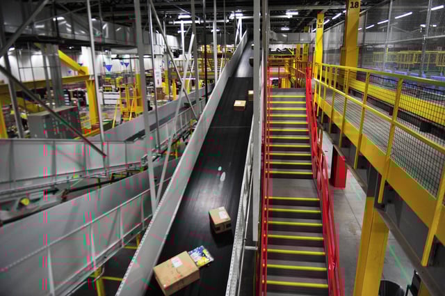 Packages ride a conveyor belt at an Amazon facility on Thursday Oct. 5, 2023.