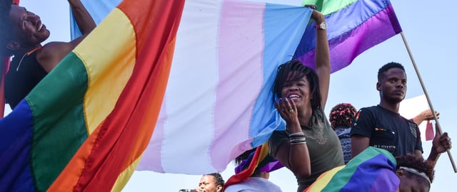 Dozens of people cheer and dance as they take part in the Namibian Lesbians, Gay, Bisexual and Transexual (LGBT) community pride Parade in the streets of the Namibian Capitol on July 29, 2017 in Windhoek. Even though there have been marches and protests against discrimination against the LGBT community in the past years, this is the first time that the community held such a parade along the capital's main street, Independence Avenue, to celebrate their identity and rights. / AFP PHOTO / Hildegard Titus © HILDEGARD TITUS/AFP via Getty Images