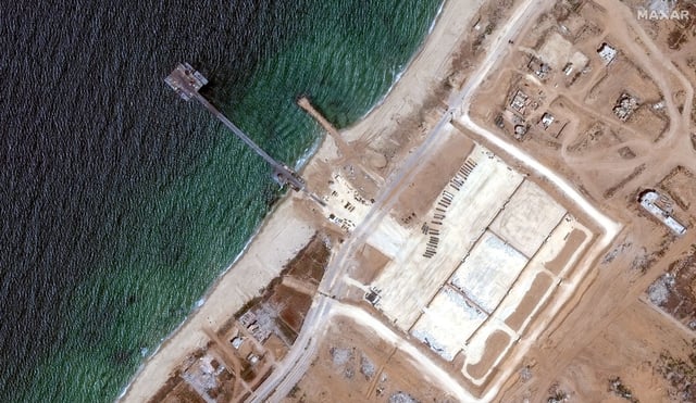 A satellite image shows U.S. military-run humanitarian aid pier in Gaza before its removal, June 12, 2024. Maxar Technologies/Handout via REUTERS THIS IMAGE HAS BEEN SUPPLIED BY A THIRD PARTY. NO RESALES. NO ARCHIVES. MANDATORY CREDIT. MUST NOT OBSCURE LOGO