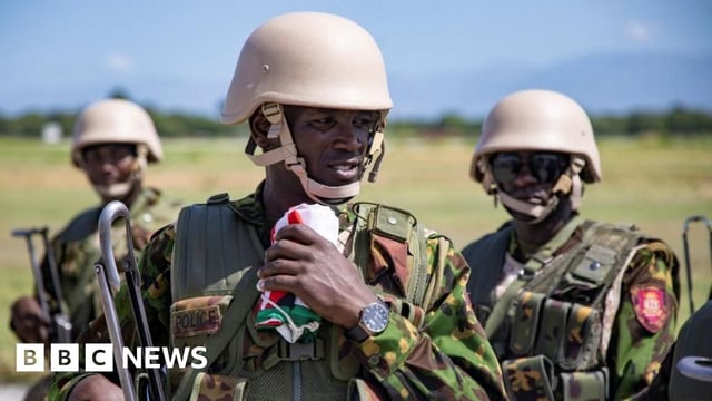 Members of a Kenyan police force, part of a new security mission, stand at the airport after disembarking, in Port-au-Prince, Haiti June 25, 2024